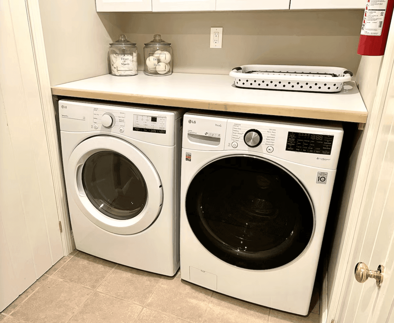Washer and dryer with labeled guest supplies