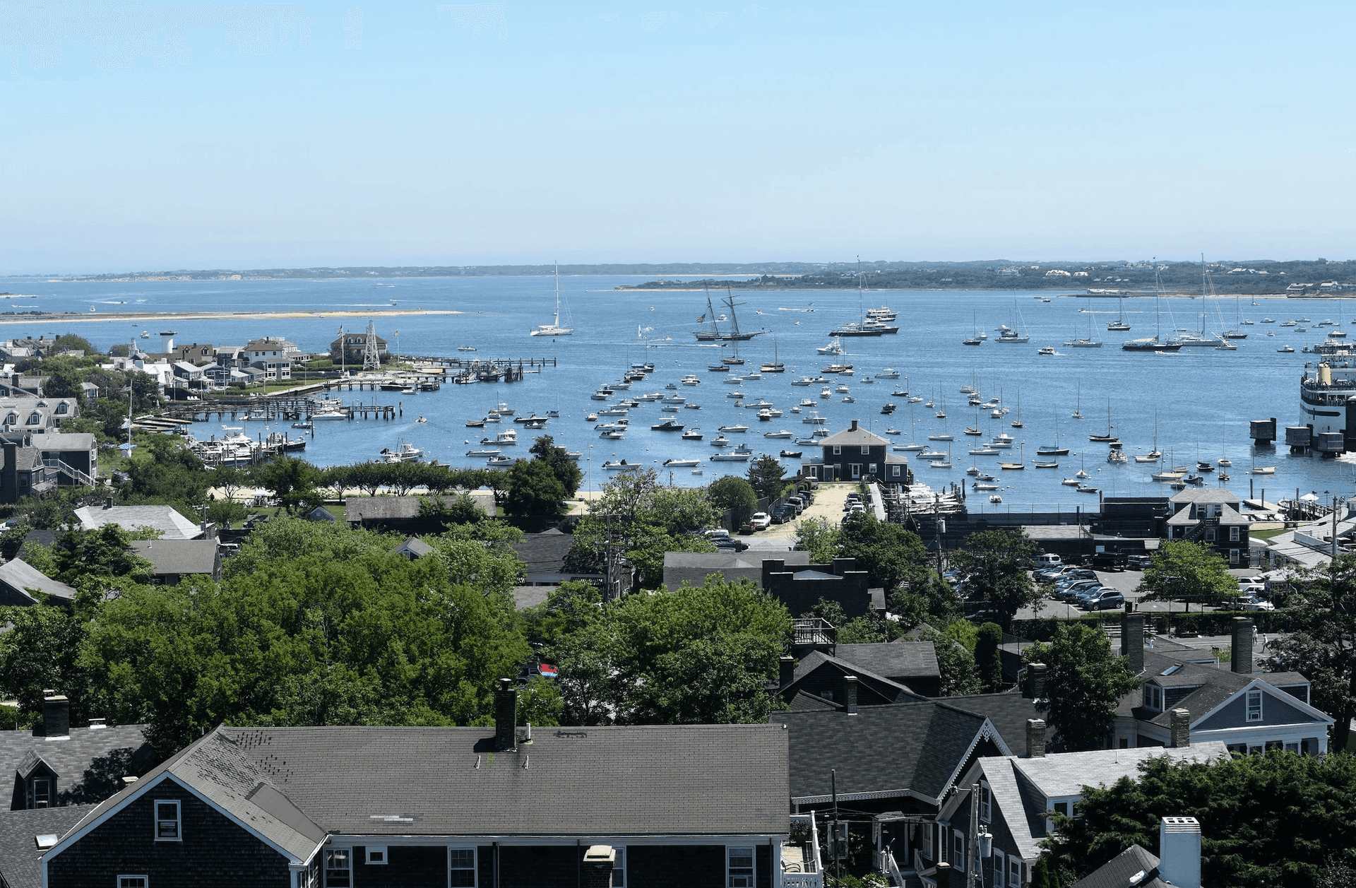 Nantucket harbor from above, with shingled roofs and the ferry