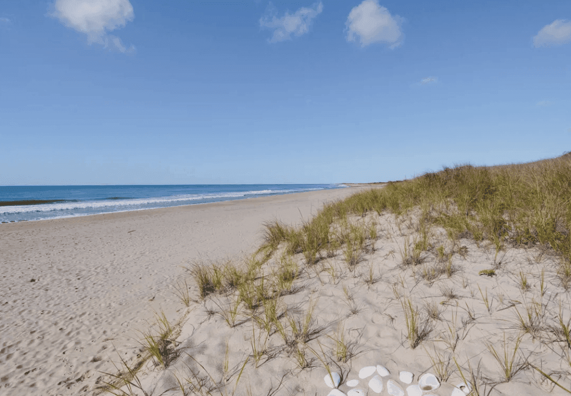 Open Nantucket beach with dune grass and a clear sky