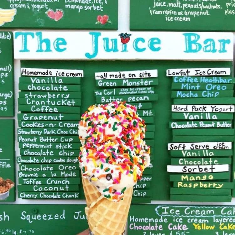 An ice cream cone in front of The Juice Bar menu on Nantucket