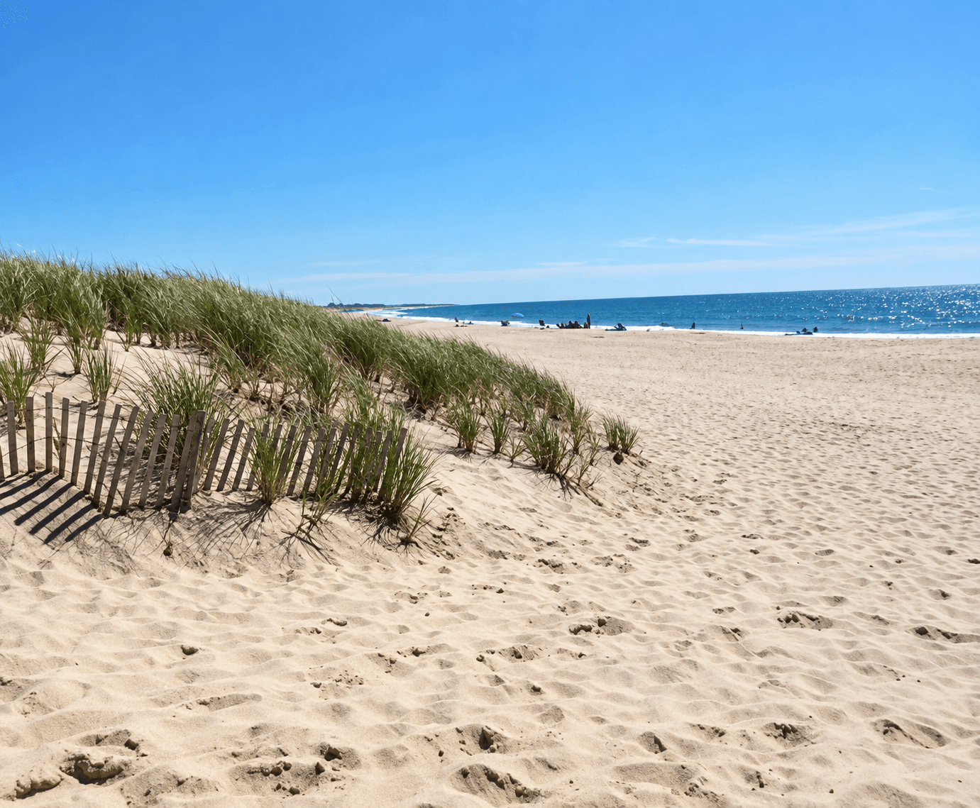 Dune fence and a wide stretch of sand at Surfside Beach