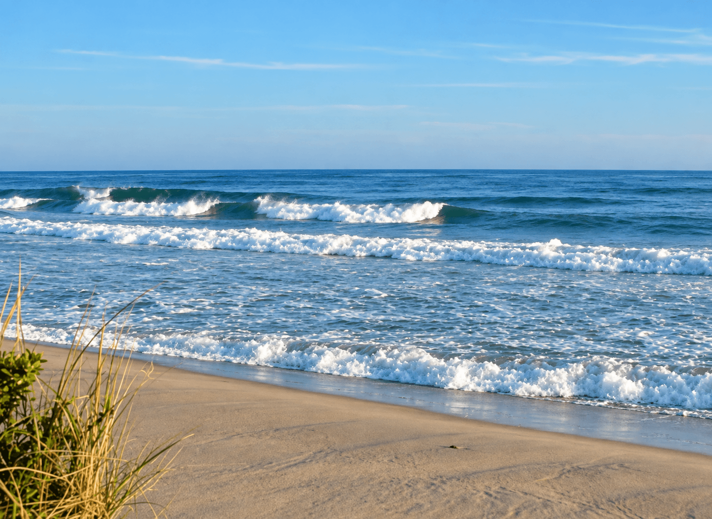 Atlantic surf rolling onto the sand at Surfside Beach